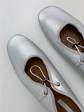Pomp String Flat Shoes