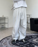 Has wide pin tuck cotton pants