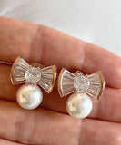 Meke Pearl Cubic Ribbon Earrings