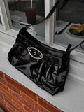 Oval buckle shoulder bag