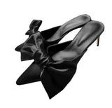 Bow tie mule heels
