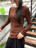 Tatin back buckle strap slit long sleeve T-shirt