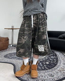Petin embroidered track Bermuda pants