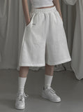 [mnem] pintuck logo bermuda shorts