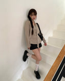 [Muffler set] Ir bean button side strap V-neck long sleeve blouse