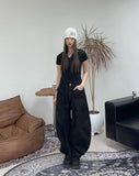Pale studded strap pants