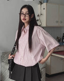 String striped over short-sleeved shirt