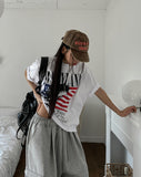 Land semi-crop over short sleeves