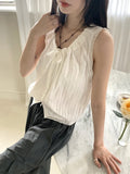 Coffin punched lace string sleeveless blouse