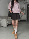 String striped over short-sleeved shirt