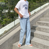 Half-bending semi-wide denim pants