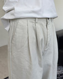 Has wide pin tuck cotton pants