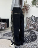 Heron embroidered denim pants