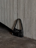 Oval buckle shoulder bag