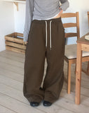 Sando back pocket hem snap pin tuck cotton pants