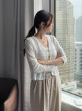 Kiet V-neck pendant knit cardigan