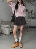 String striped over short-sleeved shirt