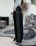 Heron embroidered denim pants