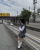 Dachi belted mini pleated skirt