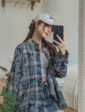 Bribe printed over checkered shirt