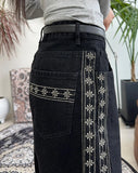 Heron embroidered denim pants