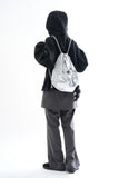 Metallic panel drawstring backpack