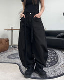 Pale studded strap pants