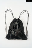 Metallic panel drawstring backpack