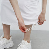 Poron string back slit pocket skirt