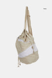 Winding zip up drawstring cross bag