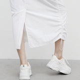 Poron string back slit pocket skirt