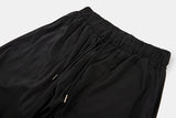 Out string glossy banding pants