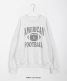 Lovendi lettering over sweatshirt