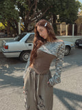 serrati brooch knit top