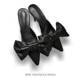 Bow tie mule heels