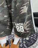 Petin embroidered track Bermuda pants