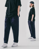 Deep tuck loose fit tapered banding pants