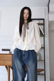 Wave shirring muffler