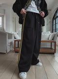Solid track line two way training pants