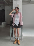 String striped over short-sleeved shirt