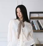 Wave shirring muffler