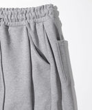 UNMEASURED LOGO TWO TUCK SWEAT PANTS