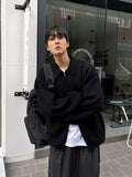 Minimal achromatic two-way cardigan