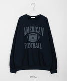 Lovendi lettering over sweatshirt