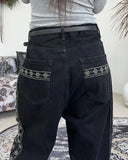 Heron embroidered denim pants