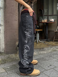 Hotfix side lettering unbalance denim pants