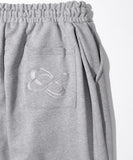 UNMEASURED LOGO TWO TUCK SWEAT PANTS