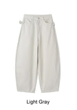 Pale studded strap pants