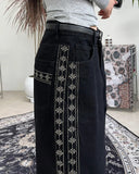 Heron embroidered denim pants