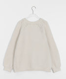 Habibi round neck cable over knit